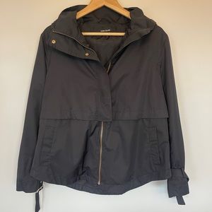 Zara’s black raincoat with hood. Barely worn
